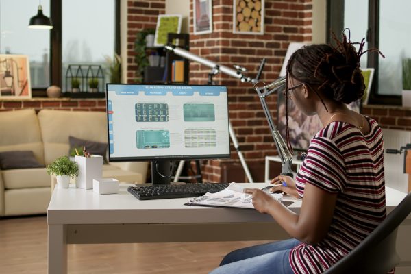 Company employee looking at web 3.0 software application, using computer to do remote work. Working with future internet website content, digital data search and text service.